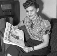 photo of Vashti McCollum reading winning headline in newspaper